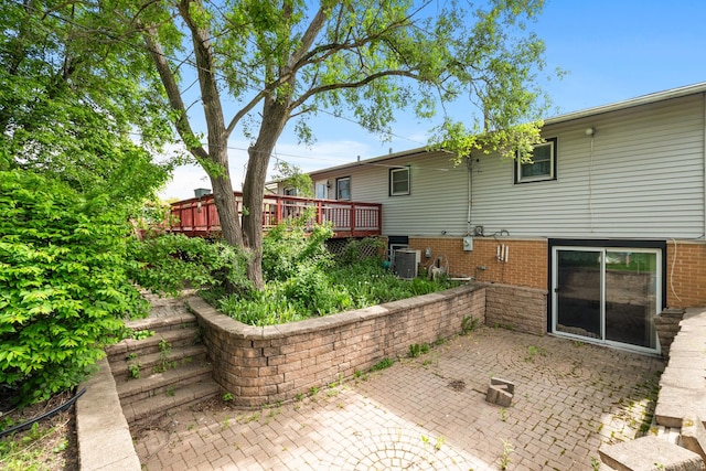 view of patio with a deck and central air condition unit