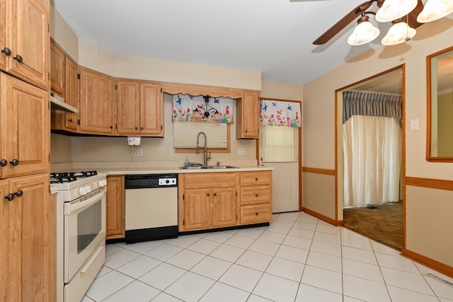kitchen featuring white appliances, a sink, under cabinet range hood, ceiling fan, and light countertops