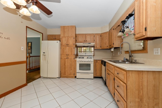 kitchen with white appliances, a sink, under cabinet range hood, light countertops, and a ceiling fan