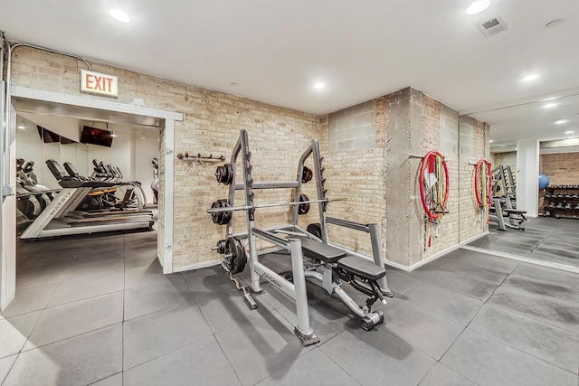 411 W Ontario St Unit 311, Chicago, IL 60654 - exercise room featuring brick wall and visible vents