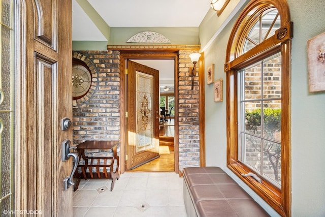 entryway with light tile patterned floors