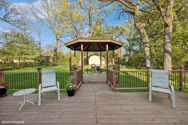 wooden terrace featuring a gazebo