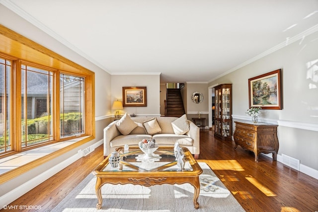 living room featuring stairway, ornamental molding, wood finished floors, and baseboards