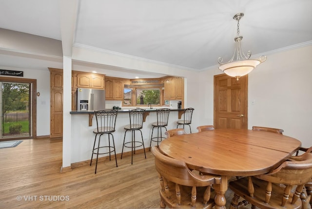 13030 S 85th Ave, Palos Park, IL 60464 - dining space featuring light wood-style flooring, healthy amount of natural light, crown molding, and baseboards