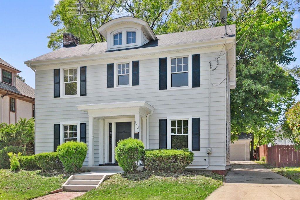 452 Wilder St, Aurora, IL 60506 - view of front facade featuring fence and a chimney
