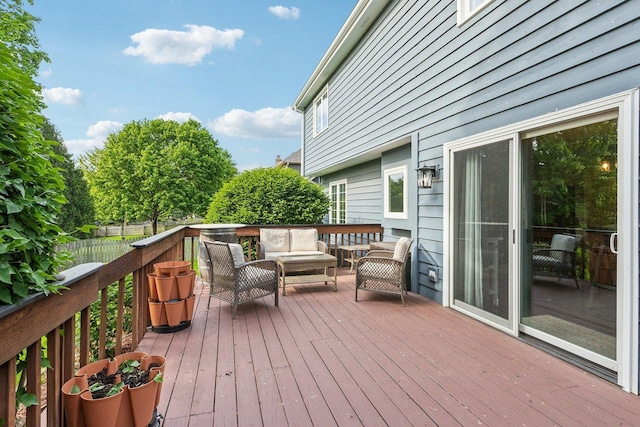 deck featuring an outdoor living space and fence