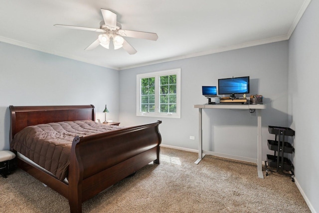 bedroom with carpet flooring, ornamental molding, baseboards, and a ceiling fan