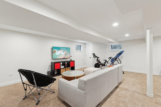 living area featuring baseboards, light carpet, and recessed lighting