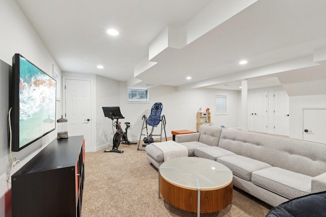 living room with recessed lighting, light colored carpet, and baseboards