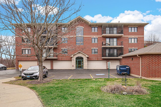 6860 W Winding Trl Unit 404, Oak Forest, IL 60452 - view of property with an attached garage and driveway