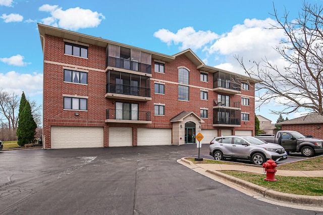 6860 W Winding Trl Unit 404, Oak Forest, IL 60452 - view of building exterior featuring driveway and an attached garage