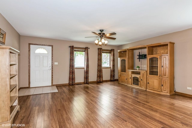 1270 Chattanooga Trl, Carol Stream, IL 60188 - unfurnished living room with a ceiling fan, baseboards, and wood finished floors