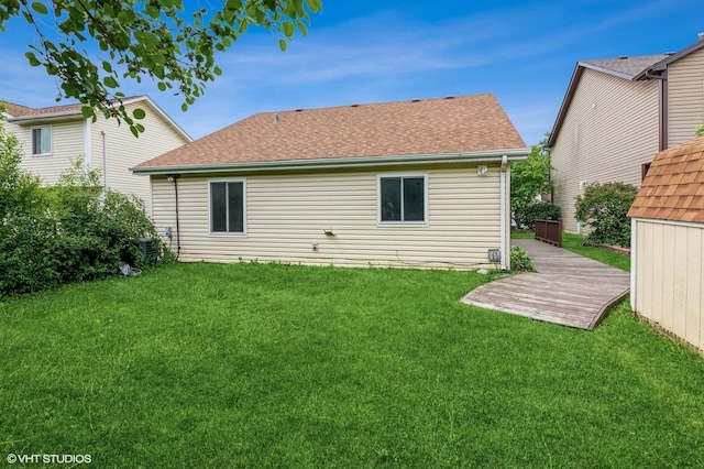 1270 Chattanooga Trl, Carol Stream, IL 60188 - back of property with a yard, roof with shingles, and a deck