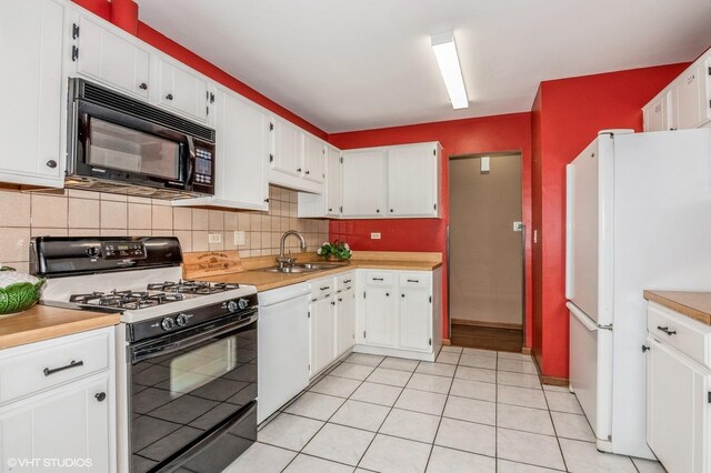 1270 Chattanooga Trl, Carol Stream, IL 60188 - kitchen featuring black appliances, a sink, tasteful backsplash, light countertops, and white cabinets