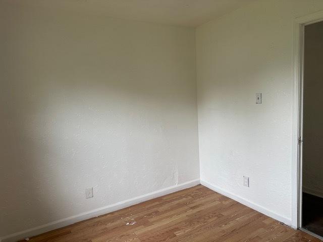 21 Westwood Dr, Cahokia, IL 62206 - spare room with wood finished floors and baseboards