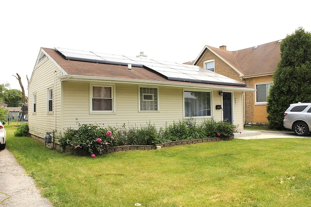 4627 Custer Ave, Lyons, IL 60534 - view of front facade featuring a front lawn and solar panels