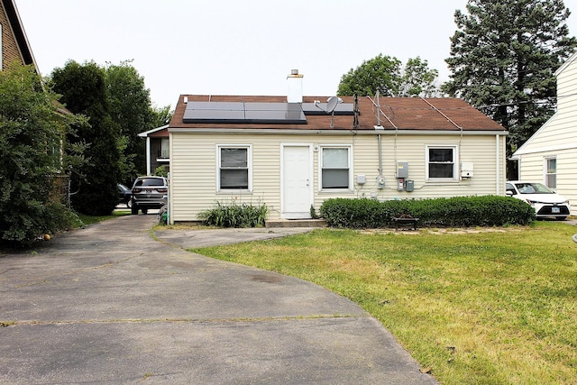 4627 Custer Ave, Lyons, IL 60534 - view of front facade with a front lawn, solar panels, and a chimney