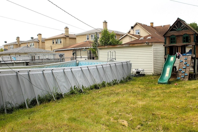 4627 Custer Ave, Lyons, IL 60534 - view of yard featuring a playground and an outdoor pool