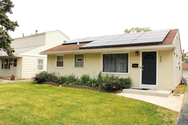 4627 Custer Ave, Lyons, IL 60534 - view of front facade featuring a front lawn, solar panels, a chimney, and a shingled roof