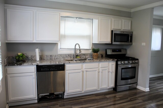 4627 Custer Ave, Lyons, IL 60534 - kitchen with appliances with stainless steel finishes, a sink, white cabinets, light stone counters, and ornamental molding