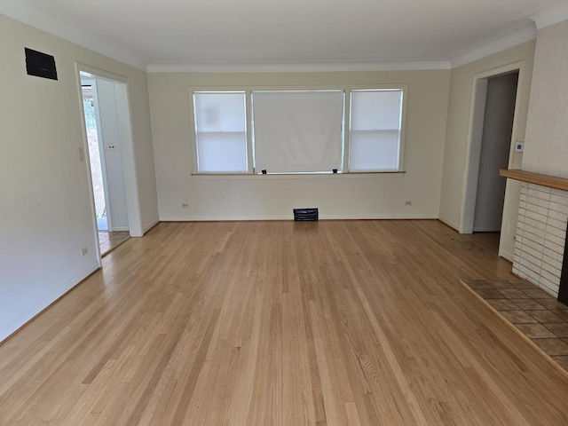 7330 N Kildare Ave, Lincolnwood, IL 60712 - unfurnished living room featuring healthy amount of natural light, light wood-style flooring, baseboards, and ornamental molding