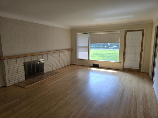 7330 N Kildare Ave, Lincolnwood, IL 60712 - unfurnished living room featuring wood finished floors, crown molding, and a fireplace