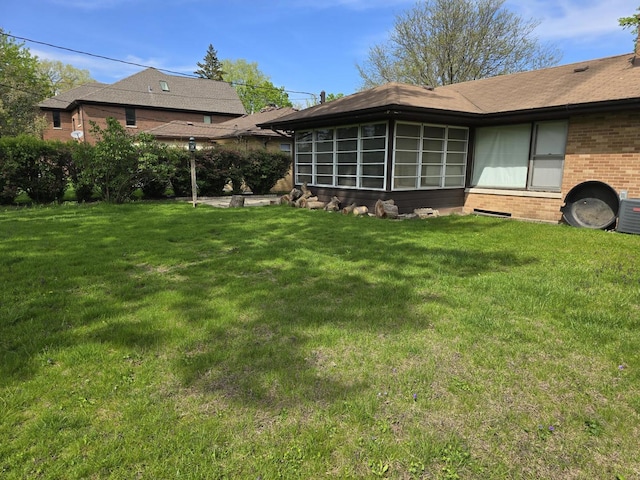 7330 N Kildare Ave, Lincolnwood, IL 60712 - view of grassy yard with a sunroom