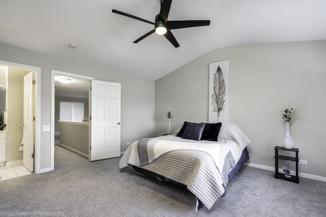 434 Locksley Dr, Streamwood, IL 60107 - bedroom with a ceiling fan, baseboards, ensuite bathroom, vaulted ceiling, and carpet floors