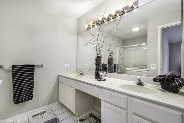 434 Locksley Dr, Streamwood, IL 60107 - full bath with a sink, tile patterned flooring, double vanity, and an enclosed shower