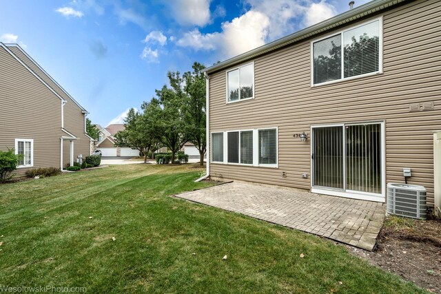 434 Locksley Dr, Streamwood, IL 60107 - rear view of house with a yard, a patio, and central AC