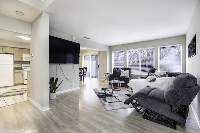 434 Locksley Dr, Streamwood, IL 60107 - living area with light wood finished floors, baseboards, and visible vents