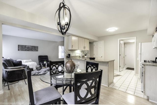 434 Locksley Dr, Streamwood, IL 60107 - dining space with baseboards and light wood-type flooring