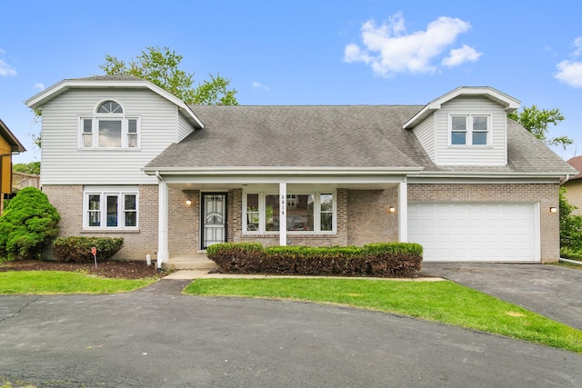 3618 Ronald Rd, Crete, IL 60417 - traditional home with asphalt driveway, brick siding, and a shingled roof
