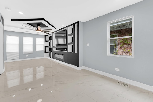 interior space featuring a ceiling fan, visible vents, baseboards, marble finish floor, and recessed lighting