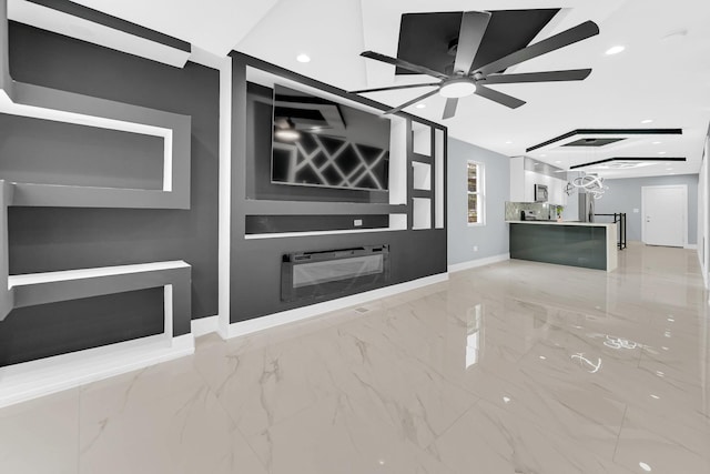 unfurnished living room with a ceiling fan, marble finish floor, baseboards, and recessed lighting