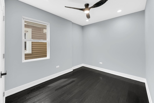 empty room featuring a ceiling fan, dark wood finished floors, visible vents, baseboards, and recessed lighting