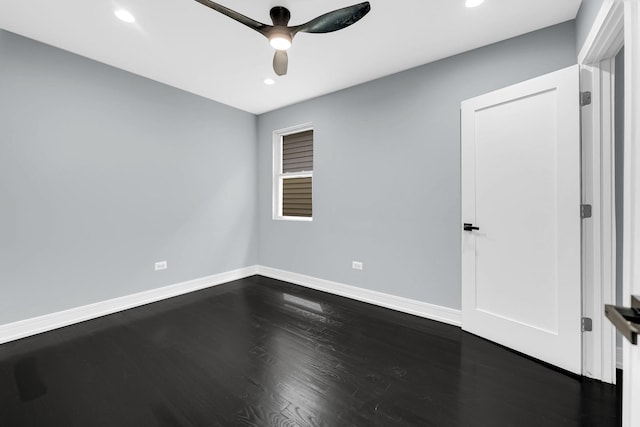 empty room with dark wood finished floors, baseboards, a ceiling fan, and recessed lighting