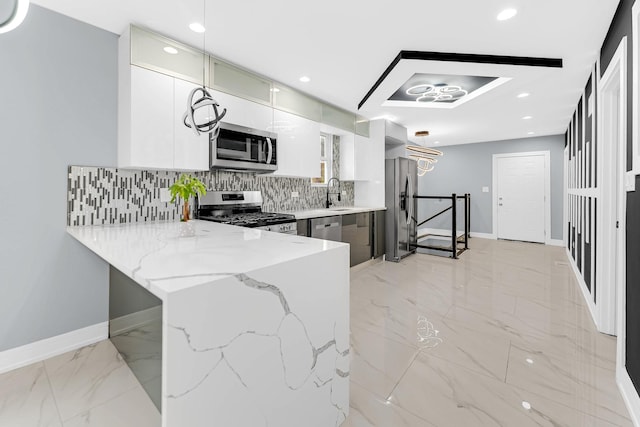 kitchen with a peninsula, stainless steel appliances, modern cabinets, tasteful backsplash, and marble finish floor