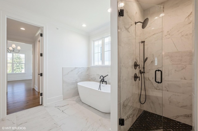 full bathroom with a freestanding bath, crown molding, a shower stall, marble finish floor, and recessed lighting