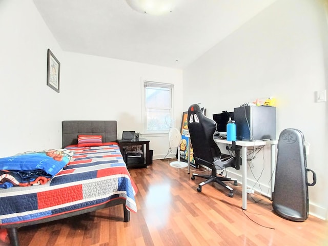 372 55th St, Clarendon Hills, IL 60514 - bedroom with wood finished floors, a desk, and baseboards