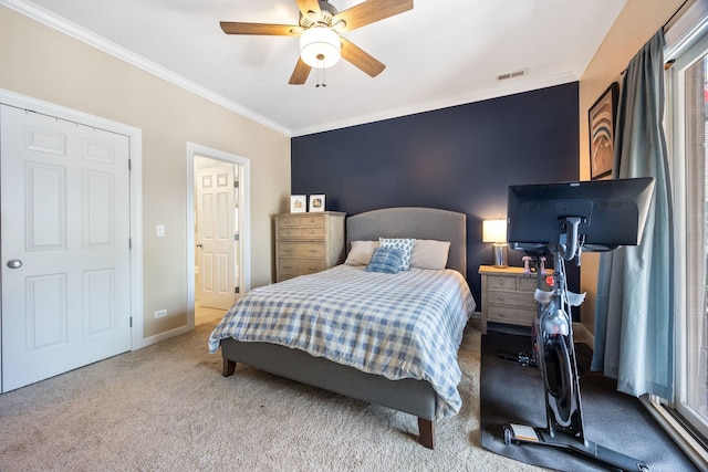 bedroom with crown molding, carpet floors, a ceiling fan, and baseboards