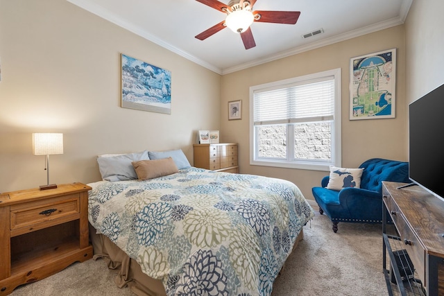 bedroom with carpet floors, crown molding, and ceiling fan