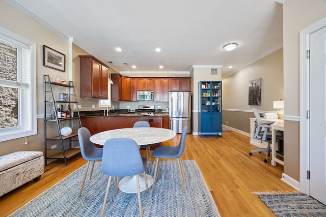 dining space with light wood-style flooring, crown molding, recessed lighting, an office area, and baseboards