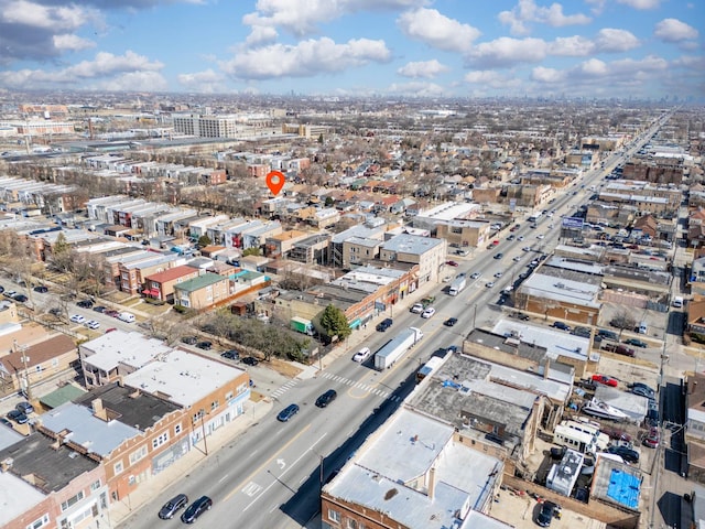 birds eye view of property with a city view