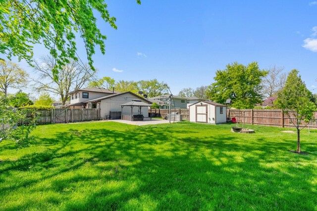 200 Marshall Dr, Des Plaines, IL 60016 - view of yard featuring a gazebo, a storage unit, a patio area, an outdoor fire pit, and an outdoor structure