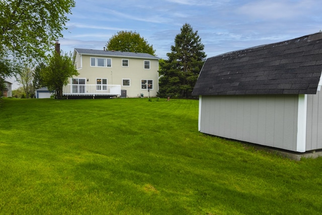 1494 Applegate Dr, Naperville, IL 60565 - rear view of house with a chimney, an outbuilding, a storage shed, and a yard