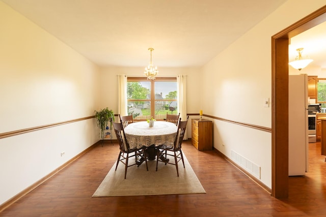 1494 Applegate Dr, Naperville, IL 60565 - dining room with a chandelier, wood finished floors, and baseboards