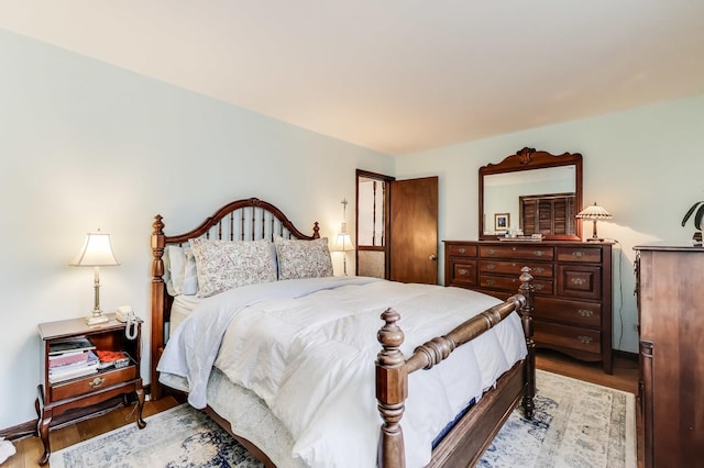 bedroom with wood finished floors