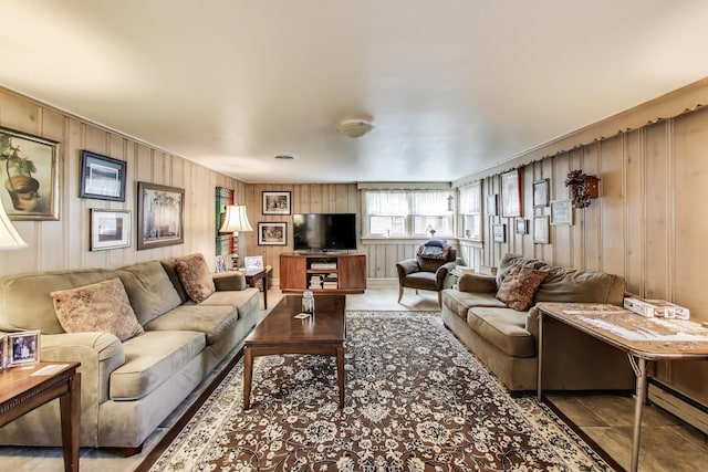 living room with wood walls