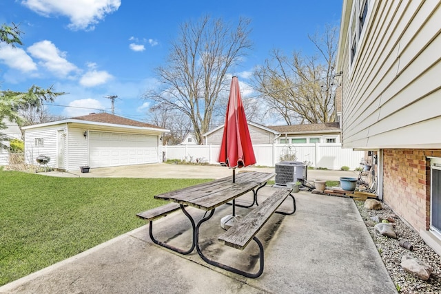 view of patio featuring an outdoor structure, central AC, and a garage